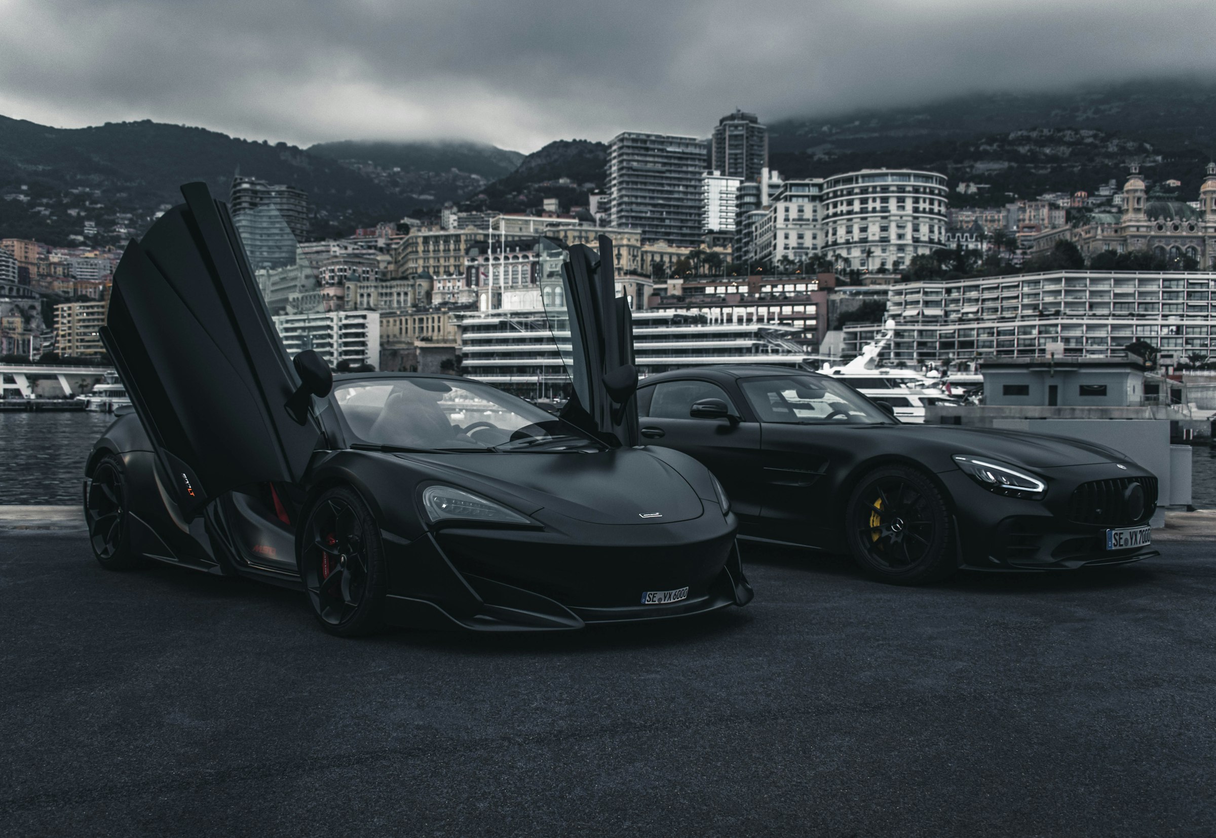 Exotic cars lined up at dusk